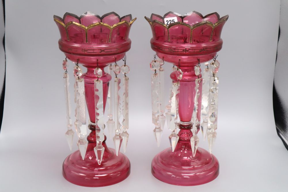 A pair of cranberry glass lustres, late 19th century, height 34cm